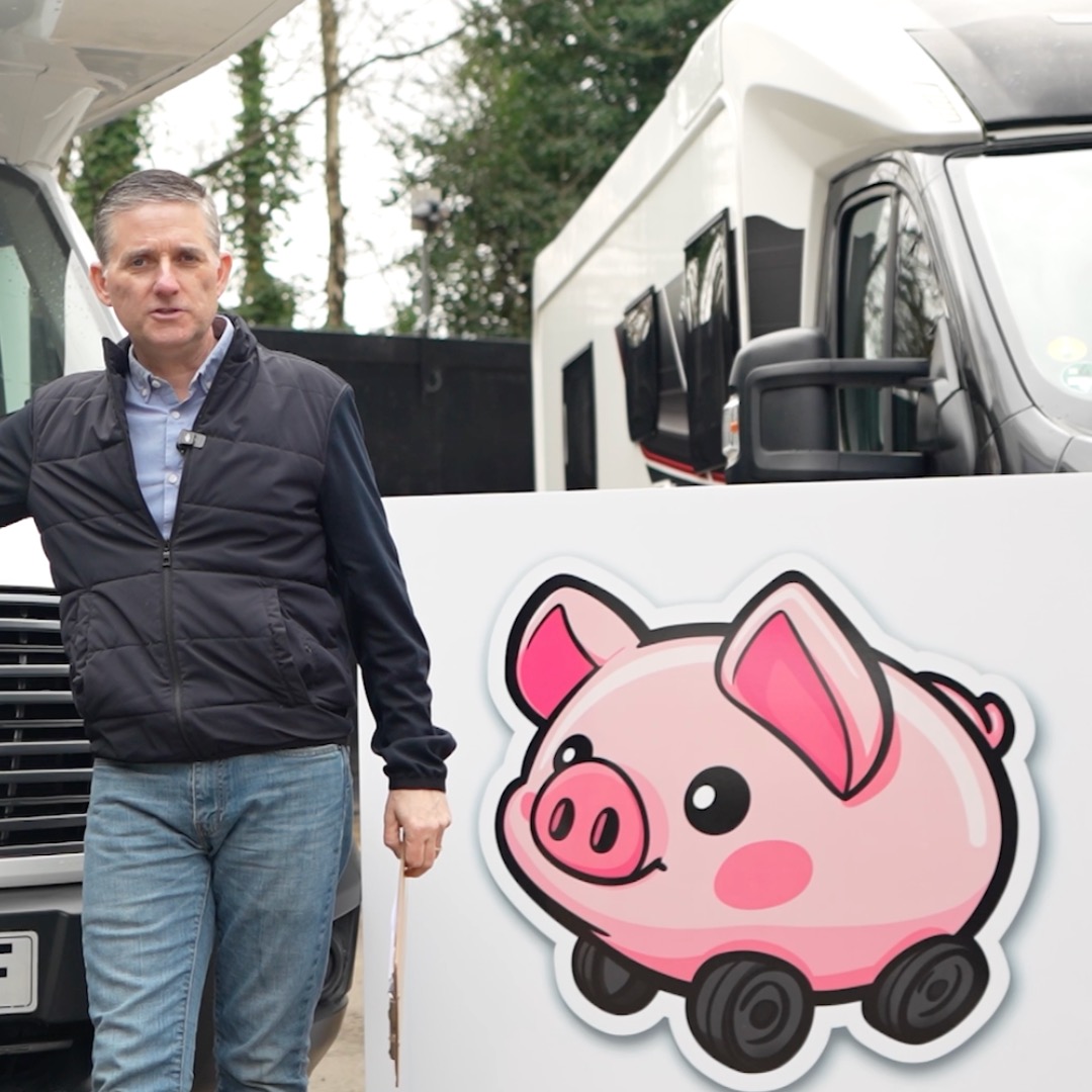 Gary Cheetham of Motorhome Pig, clipboard in hand, beside a motorhome ready to value it