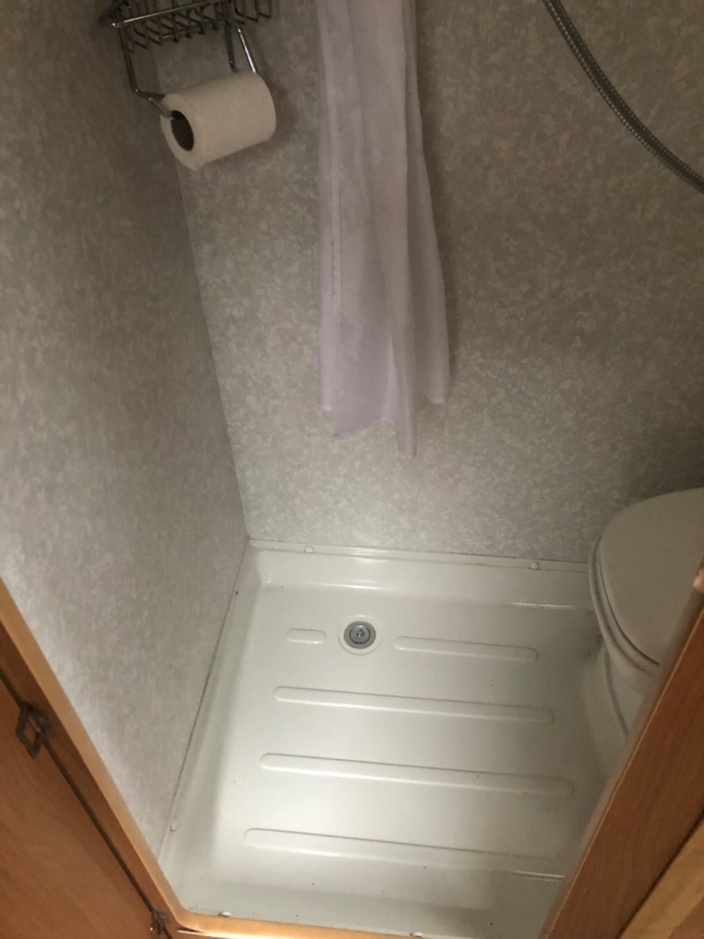 The wet room of the Autocruise Rhythm with shower and toilet