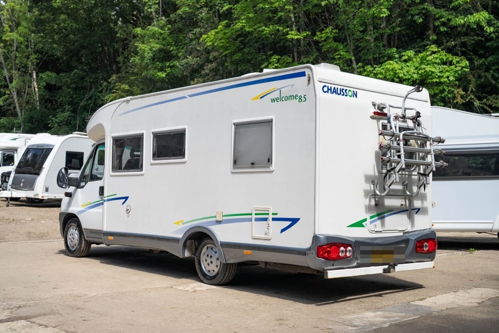 Rear three-quarter view of the Chausson Welcome 85 showing the bike rack, rear panel and Welcome 85 branding (number plate digitally obscured)