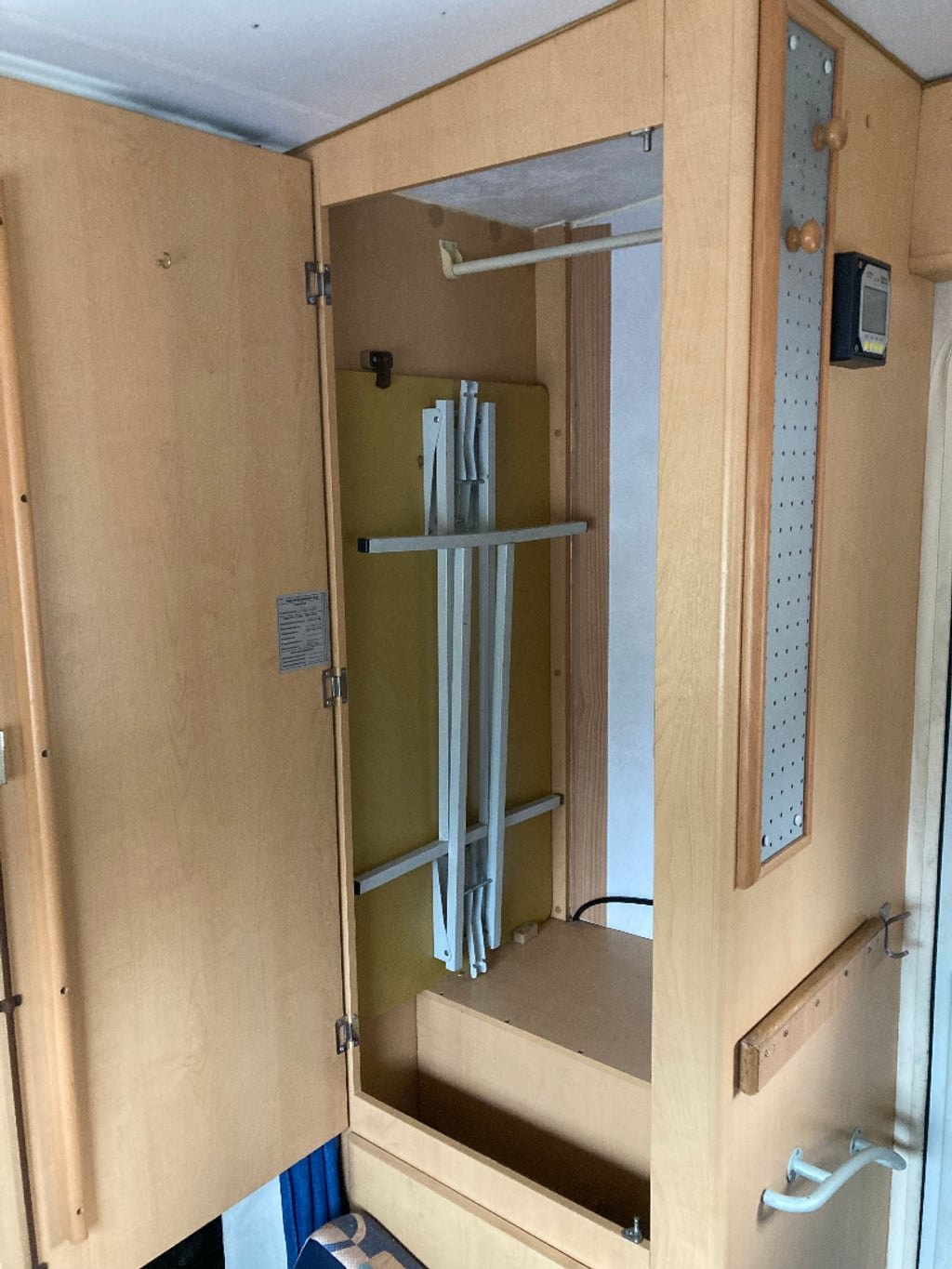 The separate shower cubicle of the Auto-Roller 15 with a folding door and grab rails