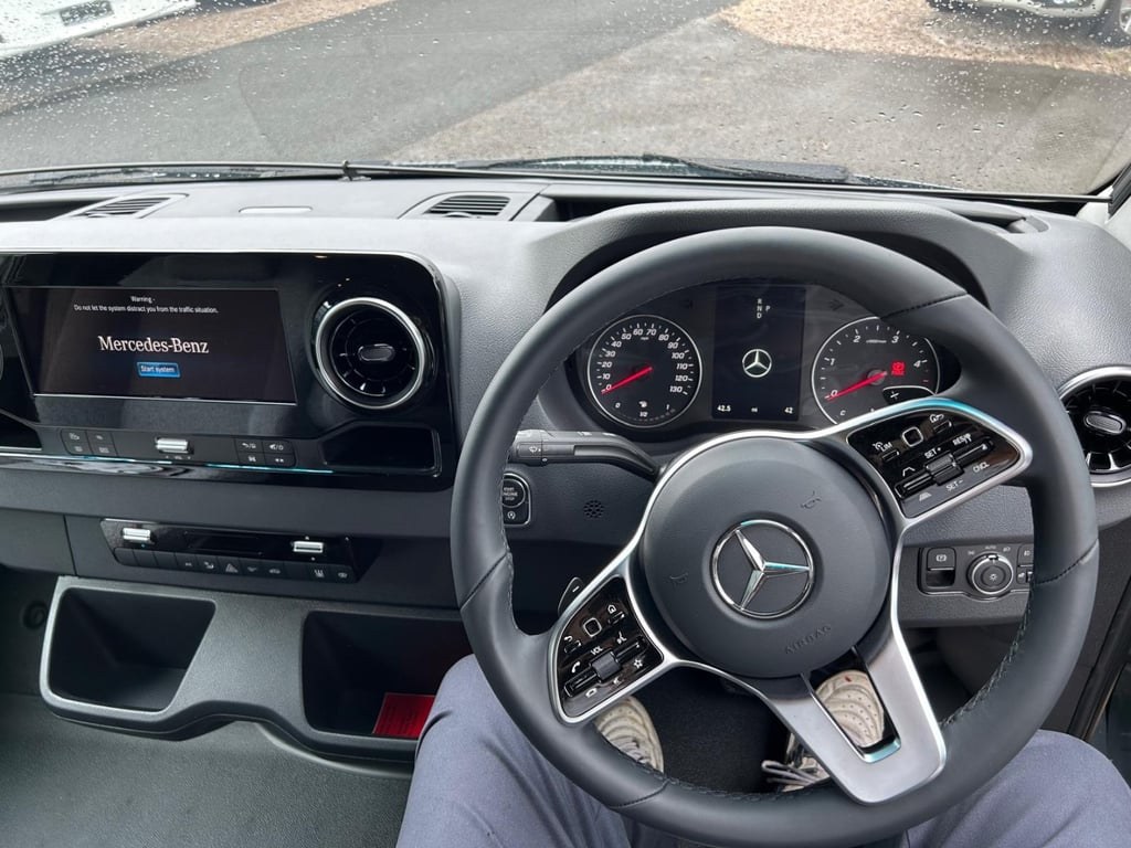 The 2025 Mercedes-Benz Sprinter cab of the Hymer Free S 600, showing the steering wheel and digital instruments